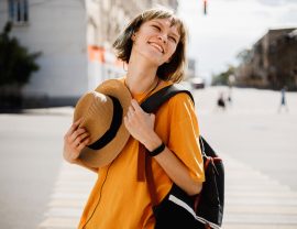 funny-young-girl-with-headphones-dressed-in-a-yell-YL2HBV8.jpg