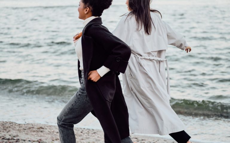 two-attractive-stylish-girls-in-trench-coats-happi-S8SUAFT.jpg
